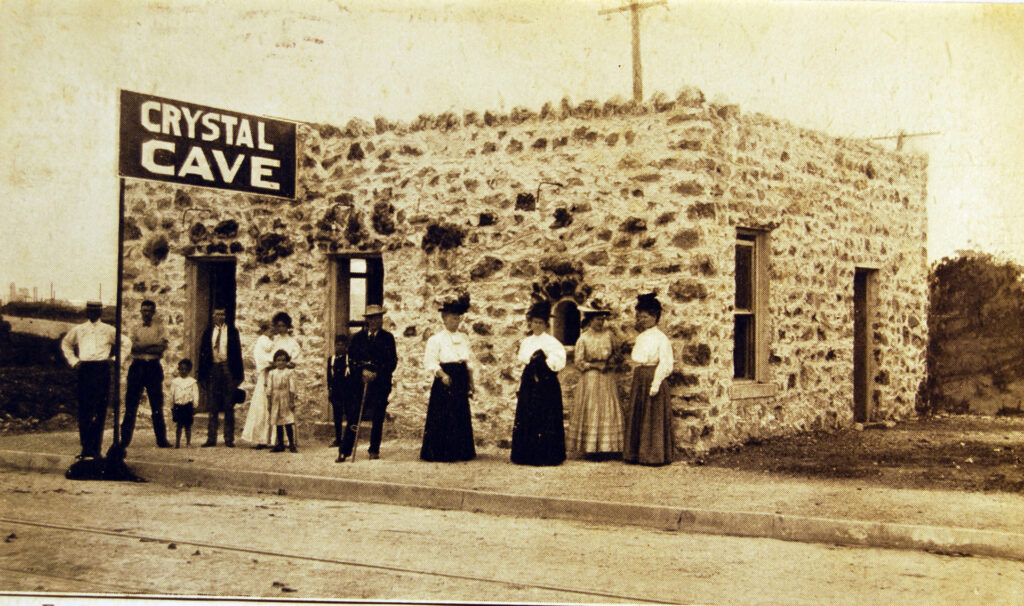 historic photo of people standing in front of Crystal Cave, ca. 1900